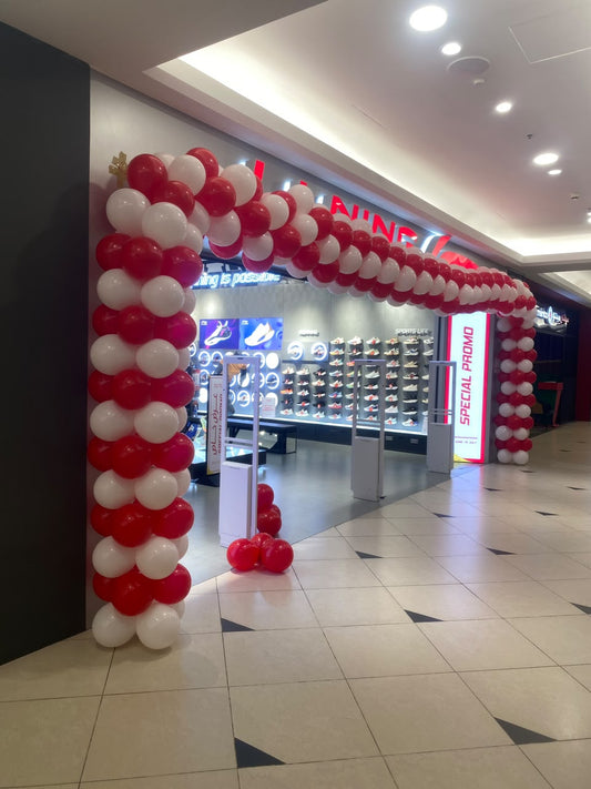 Red and white colour balloon arch
